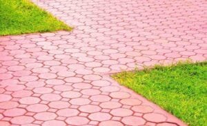 Stamped concrete patio with decorative pattern and colored finish for residential landscaping